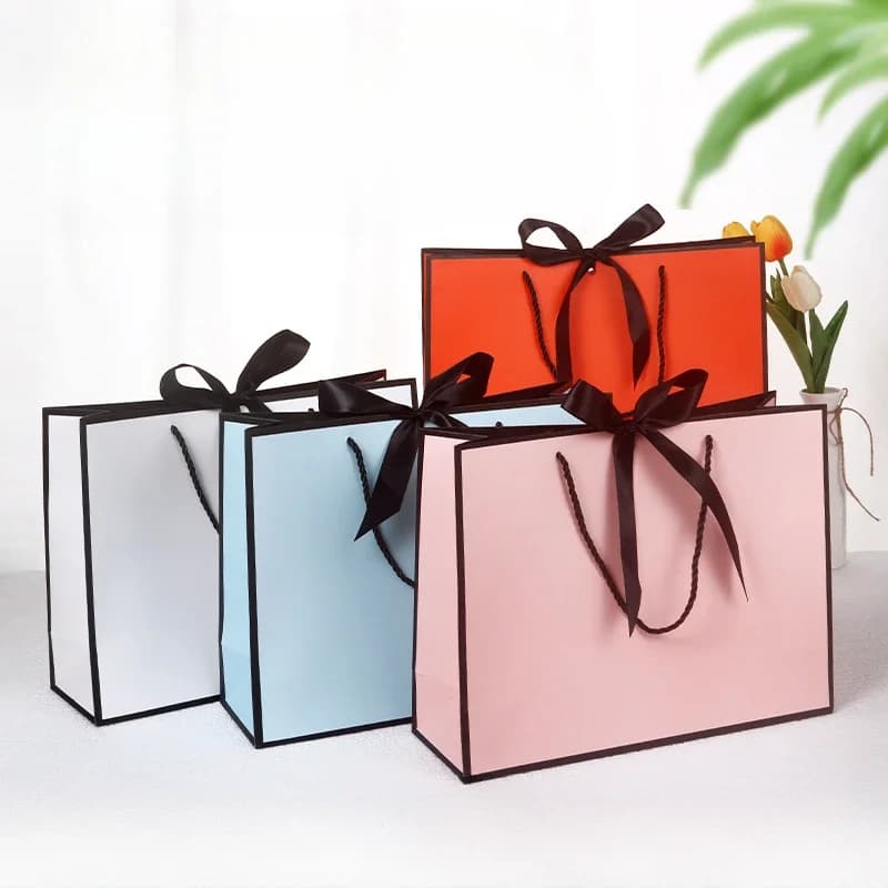 10 pièces/lot de haute qualité joli sac cadeau rose boîte-cadeau ornement pyjama livre poignée noire avec ruban boîte en papier sac emballage